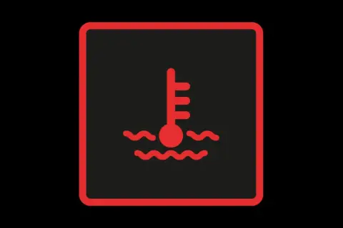 Symbole de température moteur : le voyant liquide de refroidissement s'allume, indiquant une surchauffe.