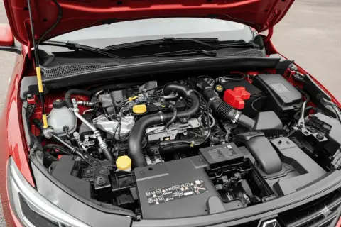 Vue du moteur d'une voiture rouge, montrant le système de distribution 1.2 TSI.