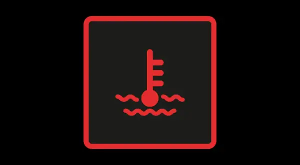 Symbole de température moteur : le voyant liquide de refroidissement s'allume, indiquant une surchauffe.