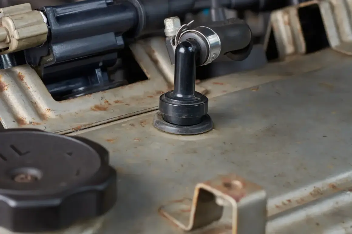 Détail du reniflard d'huile sur un moteur BMW, potentiellement bouché, causant des symptômes.