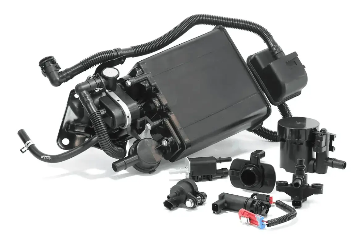 Ensemble de pièces pour système de canister d'évaporation de carburant. Un canister bouché peut causer des symptômes comme un ralenti instable.