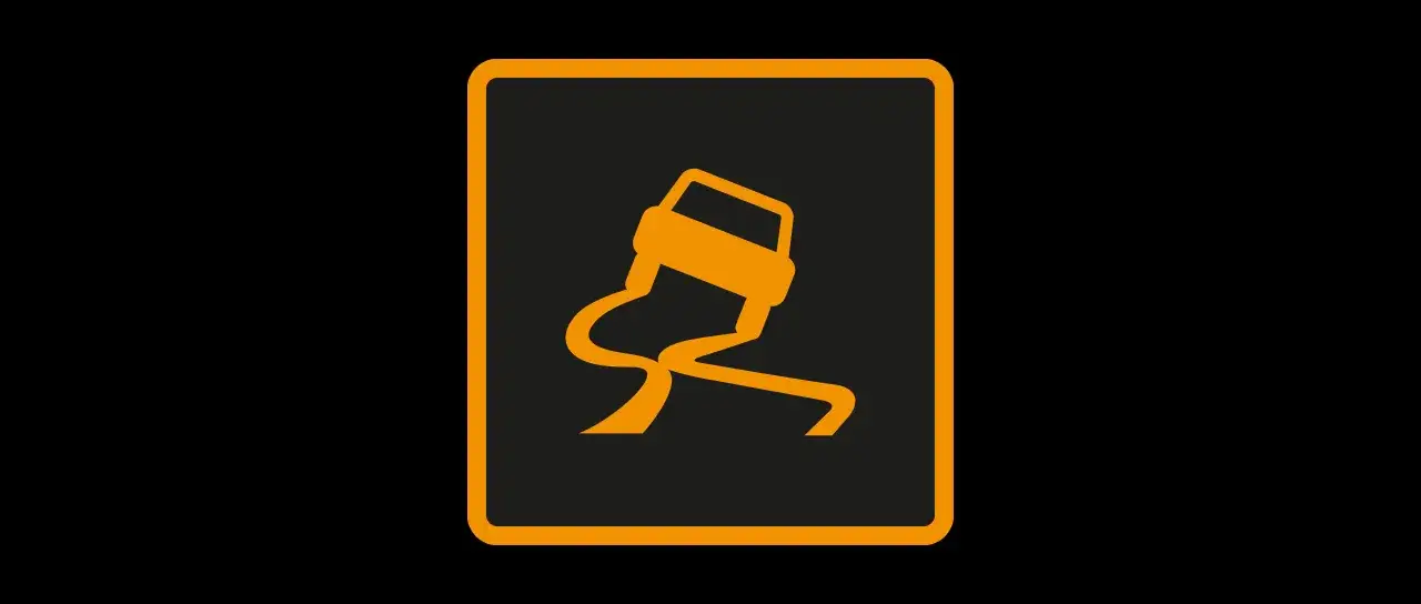 Voyant frein orange : une voiture dérape sur une route sinueuse. Attention, chaussée glissante !