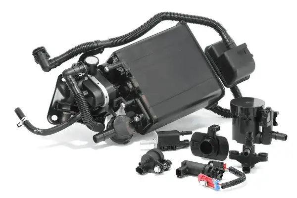 Ensemble de pièces pour système de canister d'évaporation de carburant. Un canister bouché peut causer des symptômes comme un ralenti instable.